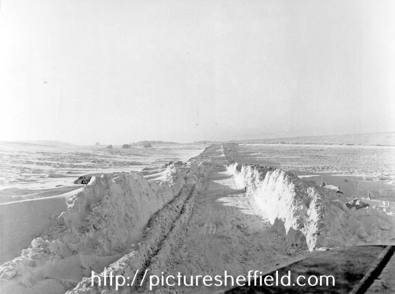 Snow clearing on Stony Ridge Road and the junction of Owler Bar Road looking South with White Hill Lodge in the distance