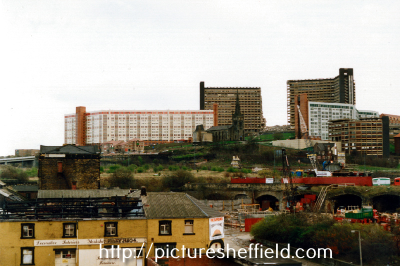 Demolition of one block of Hyde Park Flats showing St. Johns Church looking across the Canal Basin