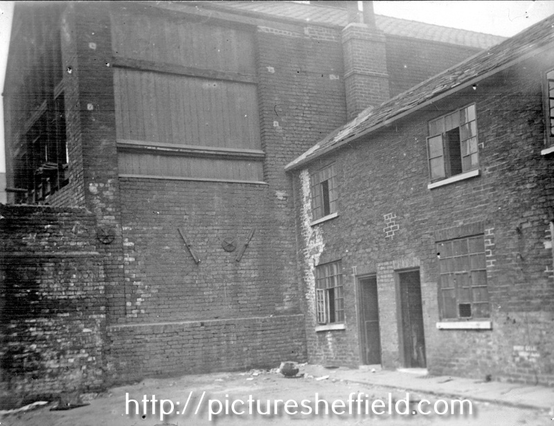 Wall belonging to Batty Langley's, timber merchant, Sheaf Saw Mills, off River Lane, showing wall plates, from Mate's Square, off River Lane, (showing slum housing on right)