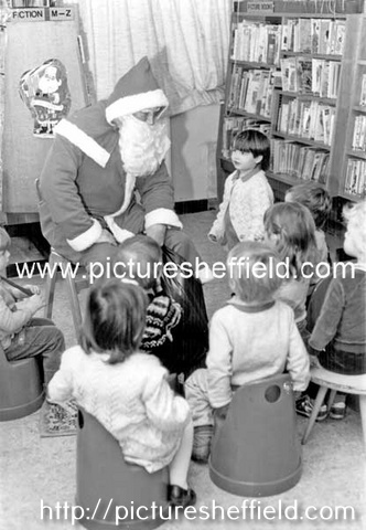 Father Christmas visiting children at Gleadless Library
