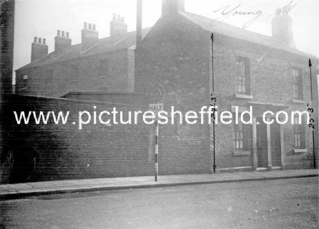 Nos 113 and 115, Young Street. Wall belongs to the playground of St. Silas' School. Rear of back to back houses fronting Moore Street in background. Court No. 4 at rear of these houses.