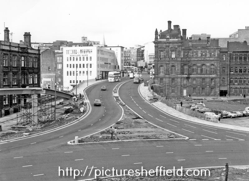 Commercial Street looking towards the Gas Company Offices on right, Electricity Supply Offices and Barclay's Bank on left. Shude Hill behind car park on right