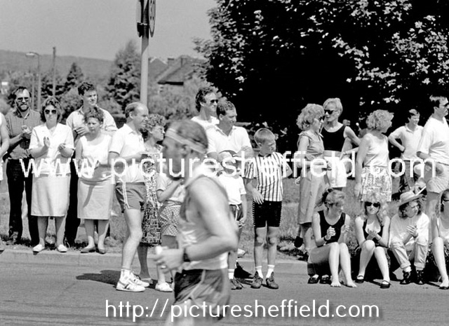 Spectators watching competitors in the Sheffield Marathon pass through Parson Cross