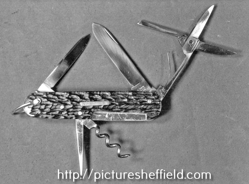 Sportsman's Knife; two blades, scissors, punch and corkskrew in Sheffield Carbon Steel shackle and a red bone stag handle by Stanley Shaw, cutler, 48 Garden Street
