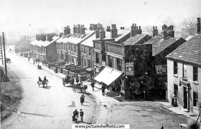 Elevated view of houses and shops, Penistone Road at Wadsley Bridge (photographed from railway bridge). New Inn, right