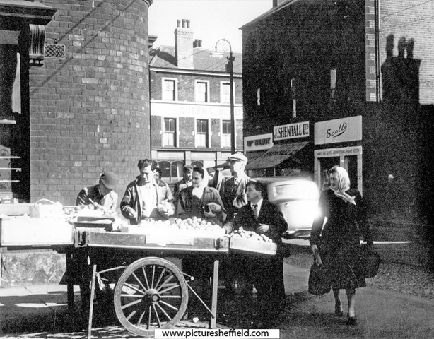 Fruit stall, Attercliffe Road with No. 648 Jn. W. Scott's, hairdressers; 650 John Shentall Ltd, grocer with Shirland Lane in the background