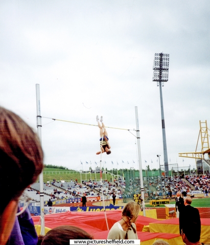 Nick Buckfield, Crawley A.C. attempting a height in the Mens Pole Vault, AAA's Championships, Don Valley Stadium with Kate Staples alias Zodiac from the tv's Gladiators with the plaits watching