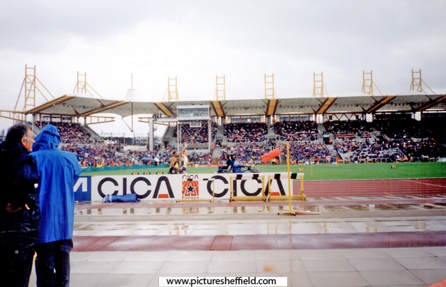 Roger Black doing a lap of honour, McDonalds International Athletics Meeting, DonValley Stadium with the windsock showing the strength of the wind for the pole vaulters