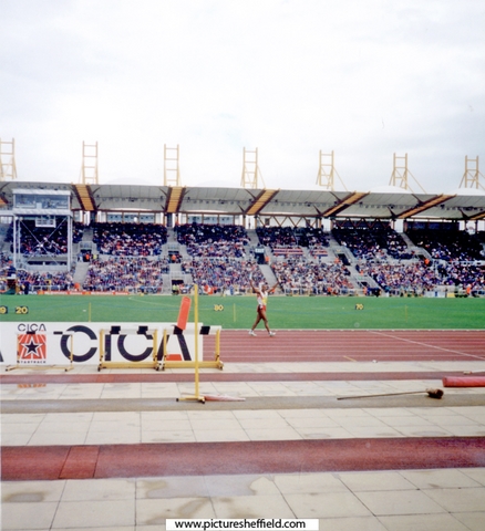 Colin Jackson on his lap of honour, McDonalds International Athletics Meeting, DonValley Stadium with the windsock showing the strength of the wind for the pole vaulters