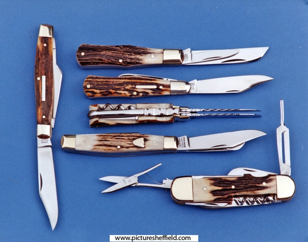 Pocket-knives with stag handles and fisherman's knife, lower right, by Stan Shaw