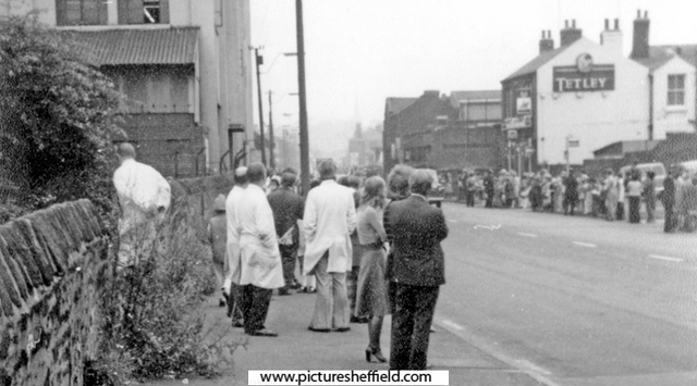 Crowds gathering on Penistone Road awaiting the visit of Queen Elizabeth II to open the new stand at Sheffield Wednesday Football Ground, Hillsborough