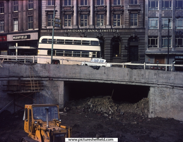 Castle Square showing the Hole in the Road under construction  with the Midland  Bank and Manfield and Sons Ltd., shoe shop, High Street in the background, c. 1967