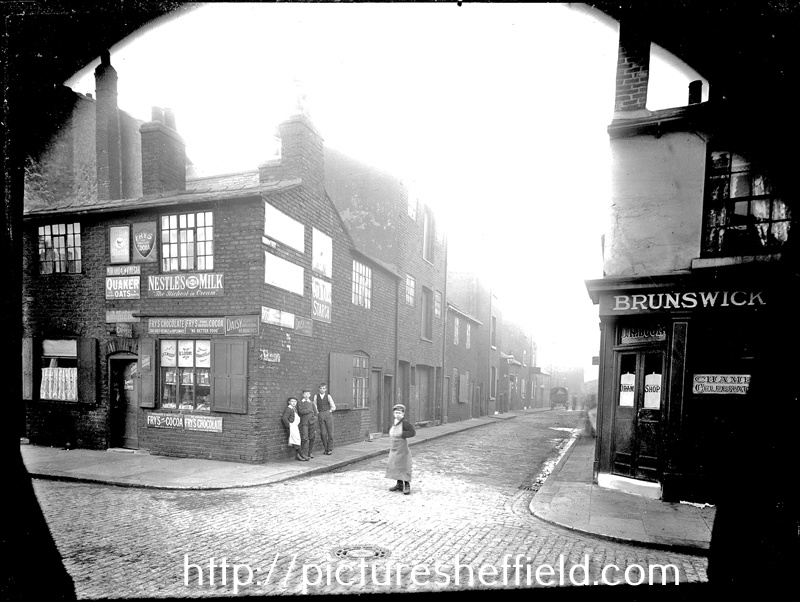 Ward Street from Bowling Green Street. No 5, Bowling Green Street, Miss Susannah Ellis, Shopkeeper (left). No 7, Joseph Henry Booth's Beerhouse, (right), probably called known as Brunswick public house, hence the sign
