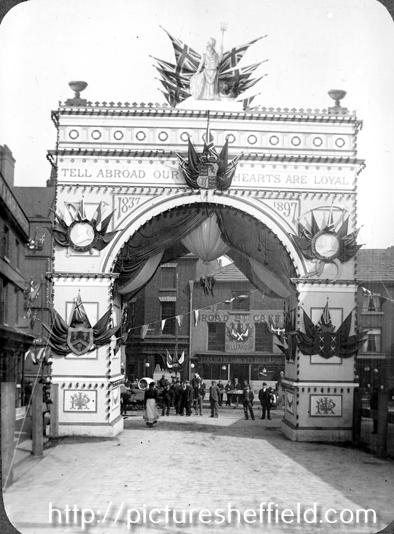 Queen Victoria's visit to Sheffield showing decorative arch at junction of Broad Street and South Street, Park, photographed from South Street looking towards Broad Street. Premises in background include Broad Street Cafe