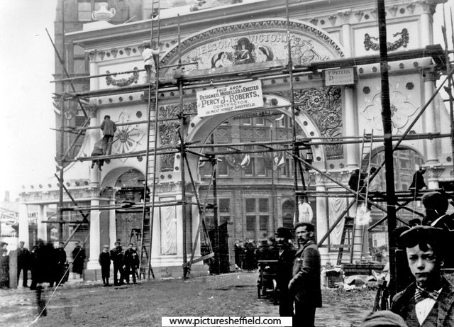 Pinstone Street, Construction of decorative arch for Queen Victoria's visit to officially open the Town Hall, designed, modelled and erected by Percy J. Roberts (based at 66, West Street)