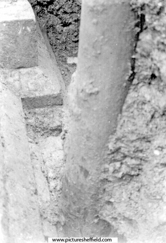 Sheffield Castle excavations recorded by J.B. Himsworth. Ruins of Courtyard buildings (walls and plinth), uncovered on Market Site, nine inches from the base of an old telegraph pole