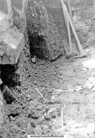 Sheffield Castle excavations recorded by J.B. Himsworth. Castle masonry and remains of square post stump