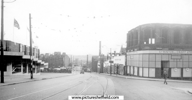 Angel Street at junction with King Street, No. 1 Syminton and Croft Ltd., ladies outfitters, right. Nos. 1 - 13 T.  B. and W. Cockayne Ltd., drapers, left. Castle House, Brightside and Carbrook Co-operative Society (Castle House No. 1) in background