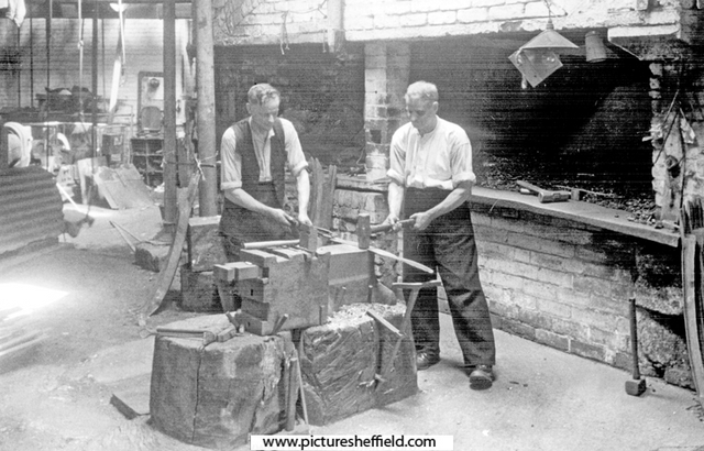 Scythe blade forging, W.A. Tyzack and Co. Ltd., scythe manufacturers, Clay Wheel Forge (also known as Hawksley), River Don at Wadsley. Photograph taken when Tyzack's were giving up the tenancy, and Messrs. Dunford and Elliott were intending to demol