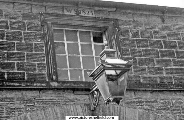 Window dated 1825 and old gas lamp over the stable block doors at Barnes Hall, off Elliott Lane, Chapeltown
