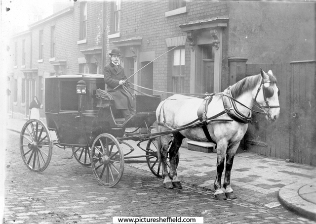 Horse drawn carriage belonging to Joseph Tomlinson and Sons Ltd. on an unidentified street