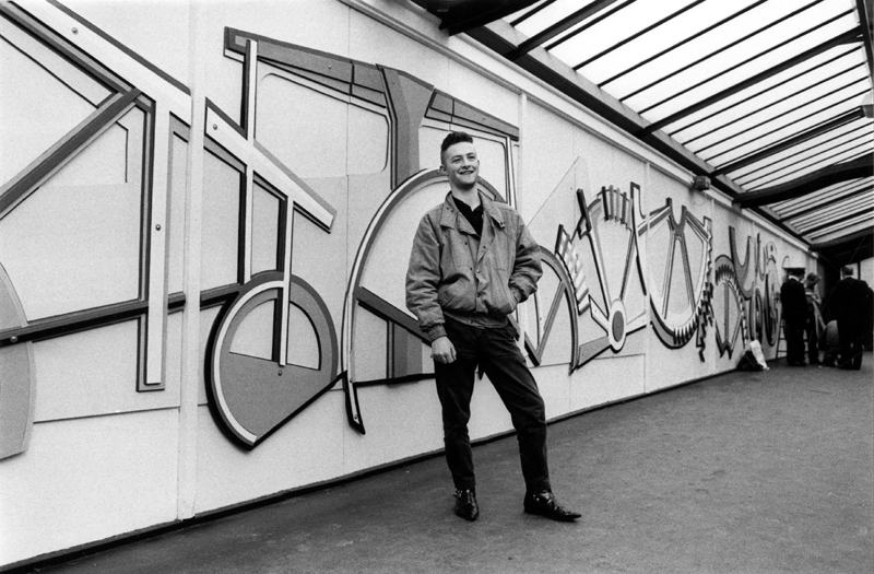 Mural on the footbridge at Sheffield Midland railway station, artist pictured but name not known 