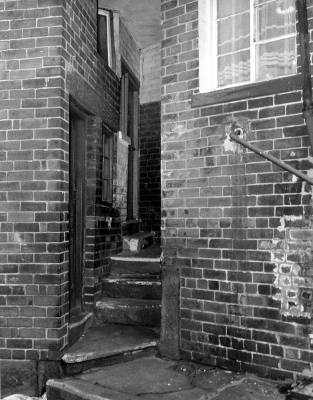 Three back doors in one small area, Nos. 3 (extreme left), Thorndon Road; 120 and 122 (window visible) Sutherland Road 