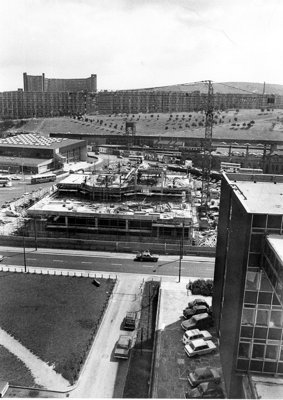 Sheffield Polytechnic Library, Pond Street under construction with Sheaf Valley Baths left and Park Hill Flats in the background