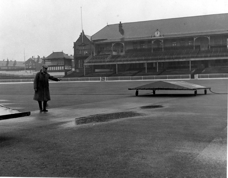 Groundsman assessing the waterlogged ground, Bramall Lane Football and Cricket Ground