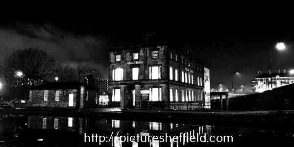 Night time view at Sheffield Canal Basin looking towards Sheaf Quay, originally offices of Sheaf Works and later a public house and then offices