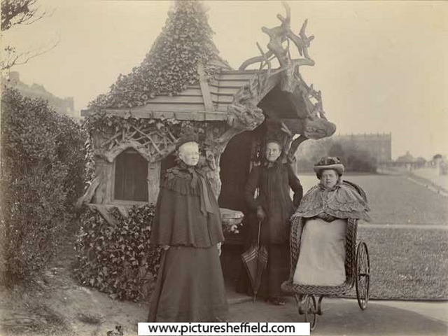Three ladies (one in a bath chair) in an unidentified park or recreation ground