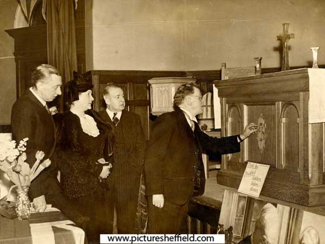 Sheffield Lord Mayor, (Alderman W. E. Yorke) examines some of the church furniture made in the SSAHS [Soldiers, Sailors and Airmen's Help Society] Workshops at Dundee [Angus, Scotland] at an exhibition held in Victoria Hall, Sheffield, c. 1948