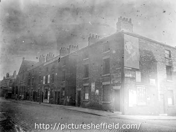 Nos. 37 - 53 Wellington Street at junction with Trafalgar Street, looking towards Rockingham Street junction. Court 4 at rear of back to back properties in foreground. Mount Tabor United Free Methodist Church and Sunday School, in background