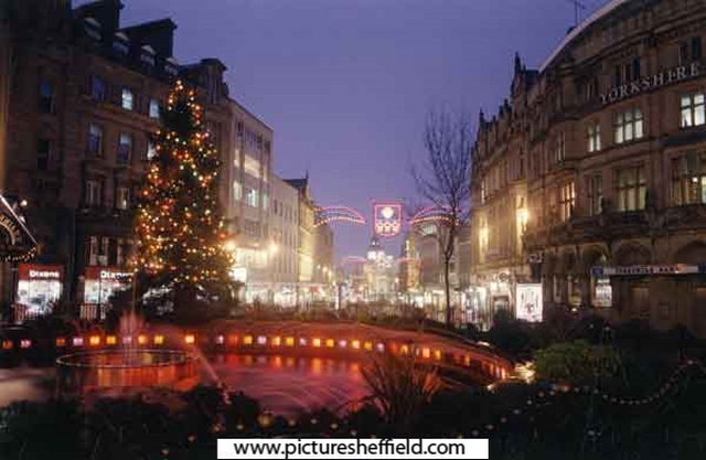 Christmas illuminations at the Goodwin Fountain, Fargate showing Yorkshire Bank on right and Dixons Ltd., photographical equipment; audiovisual and electronics store on left