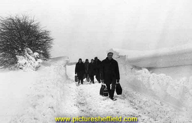 Walking back with supplies in the snow on Redmires Road