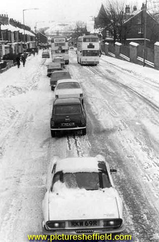 Traffic queuing on City Road during snow