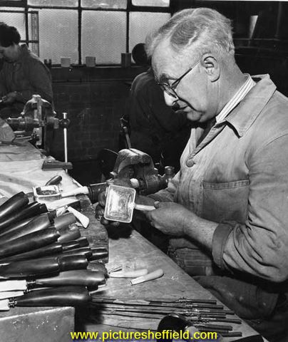 Expert at producing carving knives with buffalo horn handles at his work bench, Lewis, Rose and Co.Ltd., cutlery manufacturers, Debesco Works, Bowling Green Street