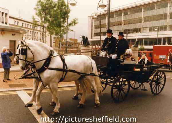 A re-enactment of the opening of the Town Hall showing a horse and carriage containing Queen Vict
