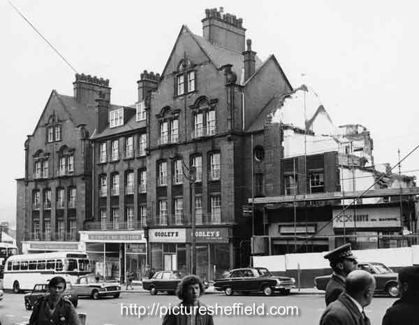 Demolition of Council flats on Snig Hill showing (left to right) Sheffield and Rotherham Constabulary (Criminal Investigation Department); W. H. Godley and Son, gents outfitters (Nos.78-80) and Arthur Davy and Sons Ltd, bakers (No.74)