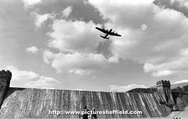 Fly past of a Lancaster bomber aircraft over Derwent Dam