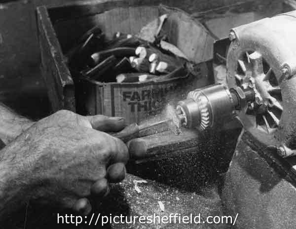Close up of Mr Gill drilling a Xylo handle at Joseph Elliot and Sons, Sylvester Works, cutlery manufacturers, Sylvester Street 