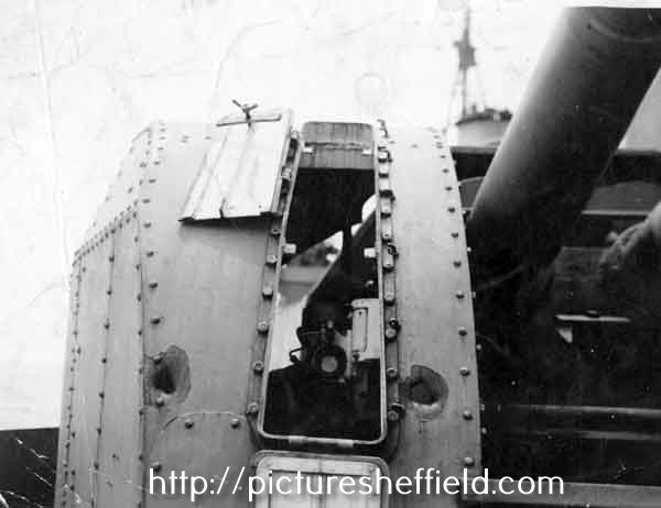 Damage done to the port 1, 4 inch gun of HMS Sheffield by the German warship, Bismark
