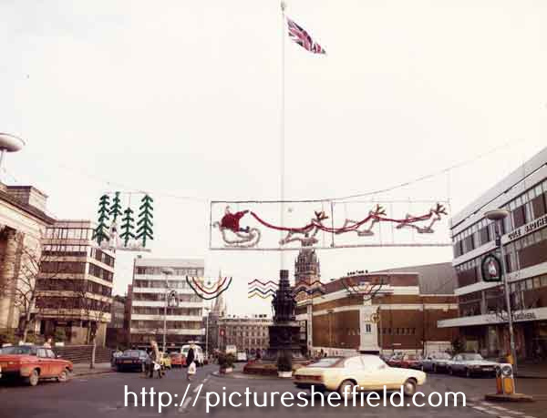 Christmas lights in Barkers Pool showing (right) Cole Brothers, department store, (centre) Barkers Pool War Memorial and Gaumont Cinema and (left) Fountain Precinct offices and New Oxford House offices