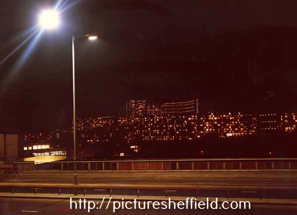 Hyde Park and Park Hill flats illuminated at night as seen from Arundel Gate