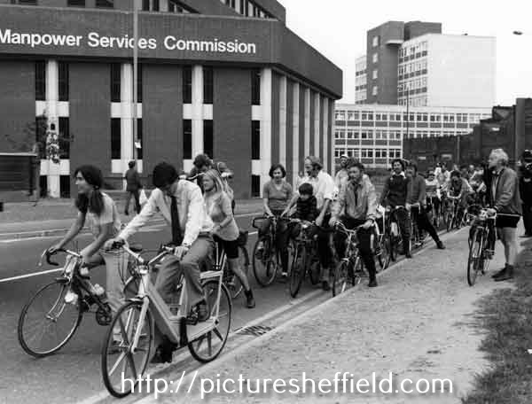 Sebastian Coe (front) leading off a bike ride at the side of the Manpower Services Commission building, South Lane