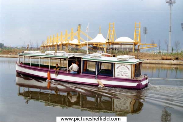 Canal boat 'Princess Mary' on the Sheffield and South Yorkshire Navigation canal with Don Valley Stadium in the background