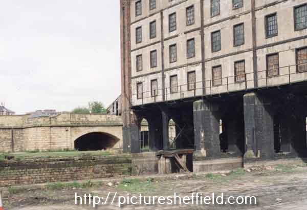 Derelict Straddle Warehouse, Sheffield Canal Basin showing (left) the Canal arches
