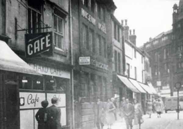 Orchard Street showing (l. to r.) No. 23 the Orchard Cafe and No. 25 Museum Hotel (latterly the Orchard public house), c.1930