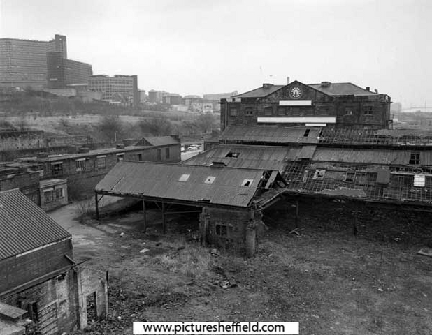 Unidentified derelict buildings, looking towards Sheaf Works, Maltravers Street (former works of Thomas Turton and Sons Ltd) across unidentified derelict buildings. Hyde Park flats are on the left..