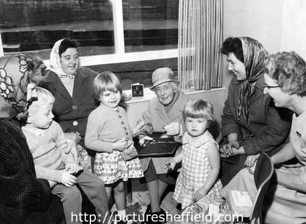 Grace Owen (benefactor of Grace Owen Nursery School, Hague Row, Park Hill Flats) with parents and children at the school at its official opening.  On the far right is Miss Cole, its first headteacher.